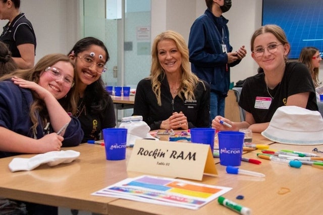 April Arzen sitting with girls at Girls Going Tech